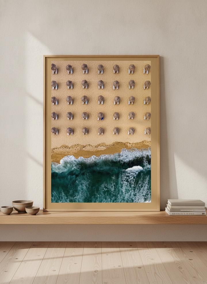 Modern wall art print standing on a shelf in a warm Japandi bathroom