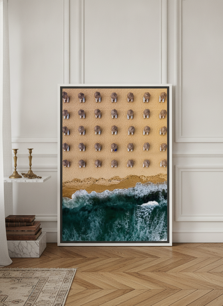 Canvas wall art with a white surround leaning against the wall in a Parisian bathroom