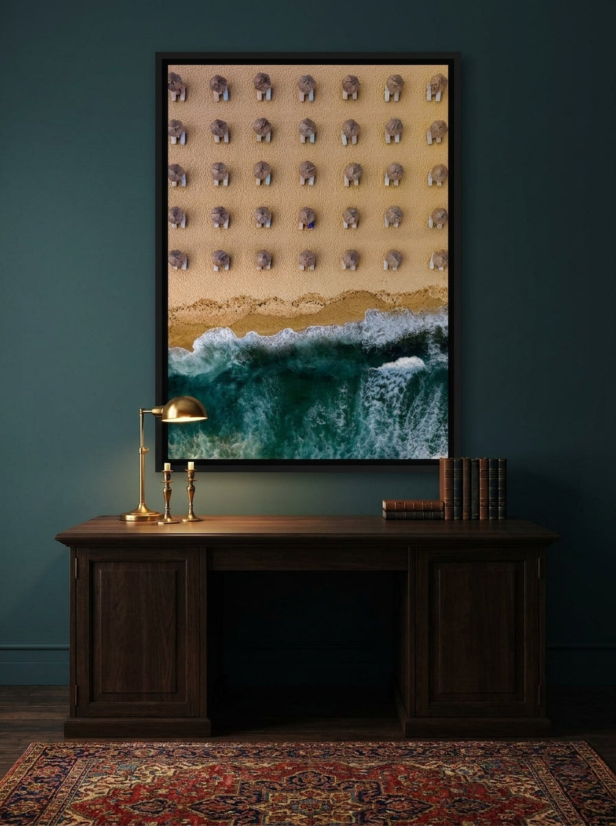Canvas wall art with a black surround styled on the wall in a moody home office