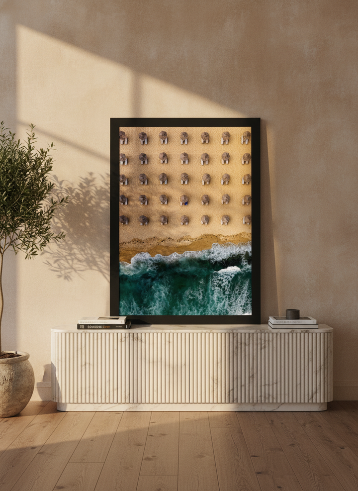 Modern wall art print standing on a sideboard in a luxe bedroom