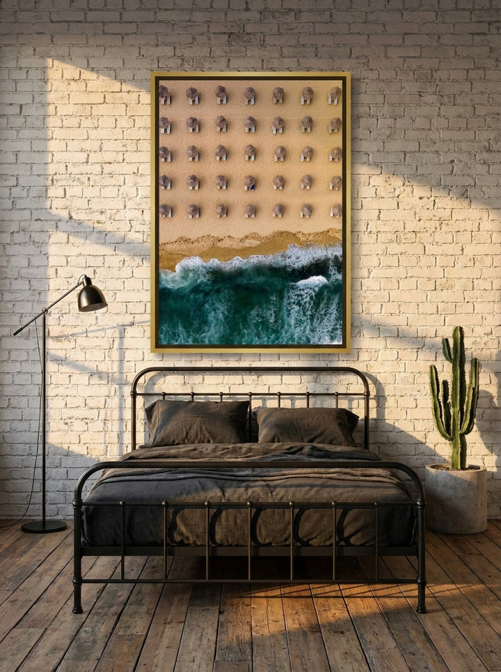 Canvas wall art with a gold leaf surround styled on the wall in an industrial loft bedroom