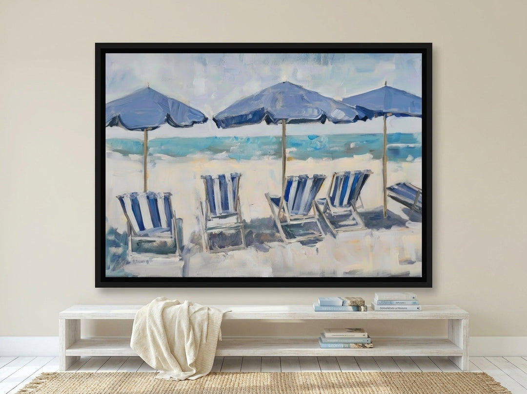 Canvas wall art with a black surround styled on the wall in a coastal living room