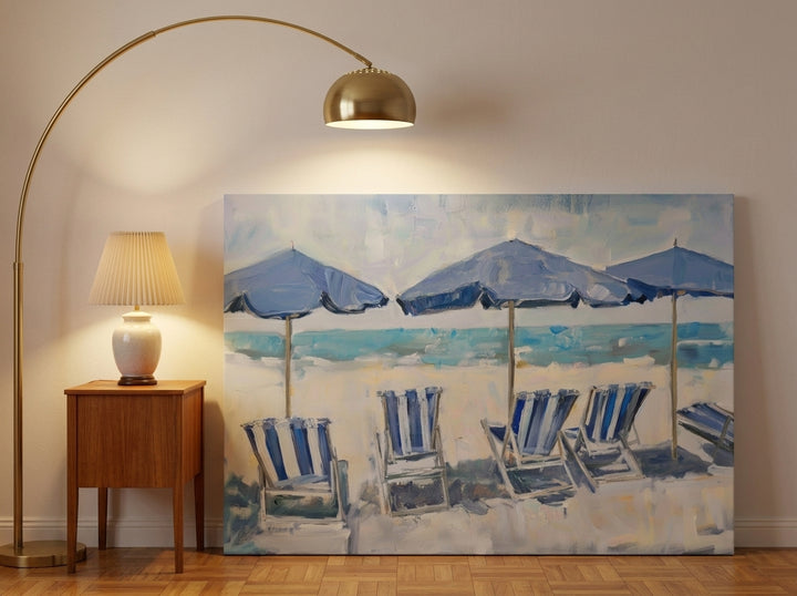 Stretched canvas wall art leaning against the wall in a mid-century bedroom
