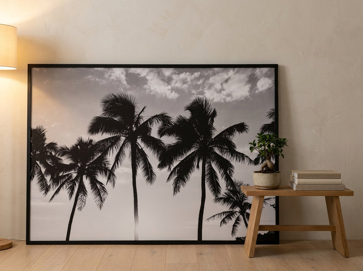 Oversized statement modern wall art print leaning against the wall in a warm Japandi living room