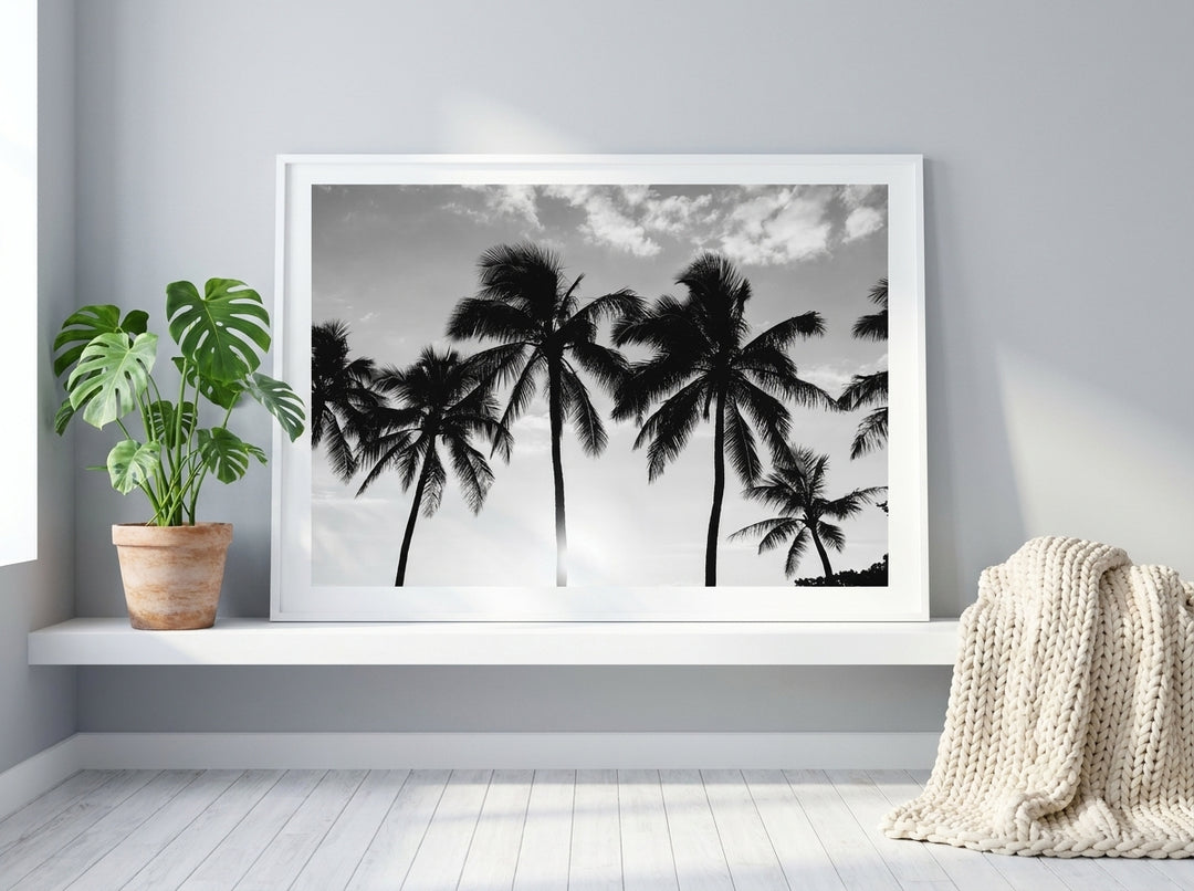 Modern wall art print standing on a shelf in a bright Scandinavian bedroom