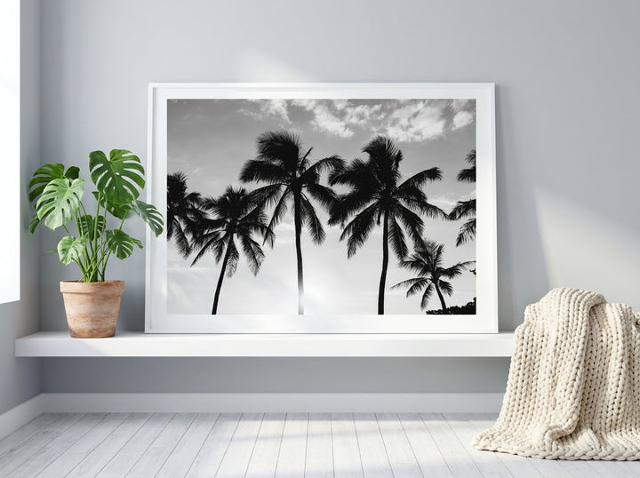 Modern wall art print standing on a shelf in a bright Scandinavian bedroom