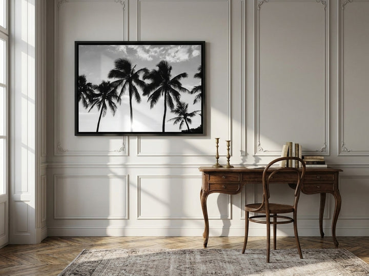 Canvas wall art with a black surround styled on the wall in a Parisian home office