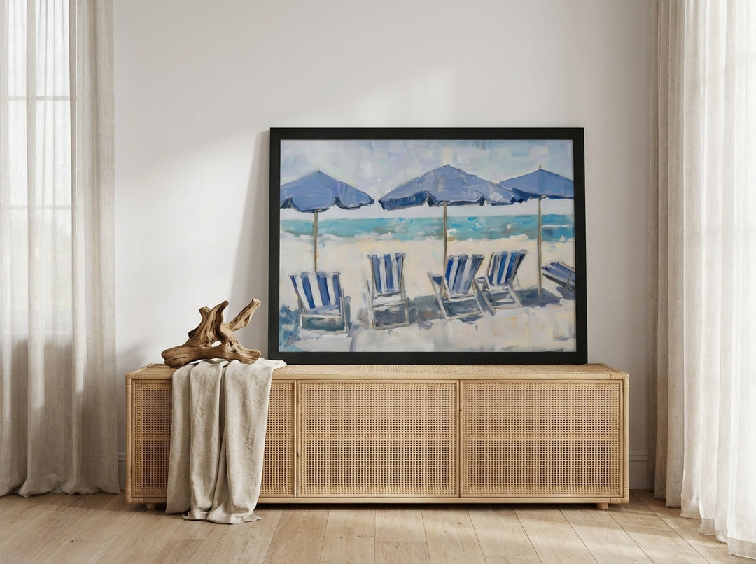 Modern wall art print standing on a sideboard in a coastal dining room
