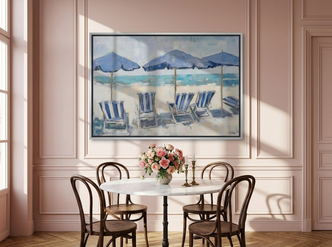 Canvas wall art with a silver leaf surround styled on the wall in a Parisian dining room