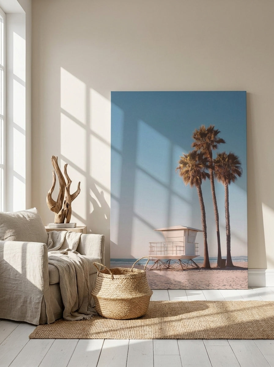 Stretched canvas wall art leaning against the wall in a coastal living room