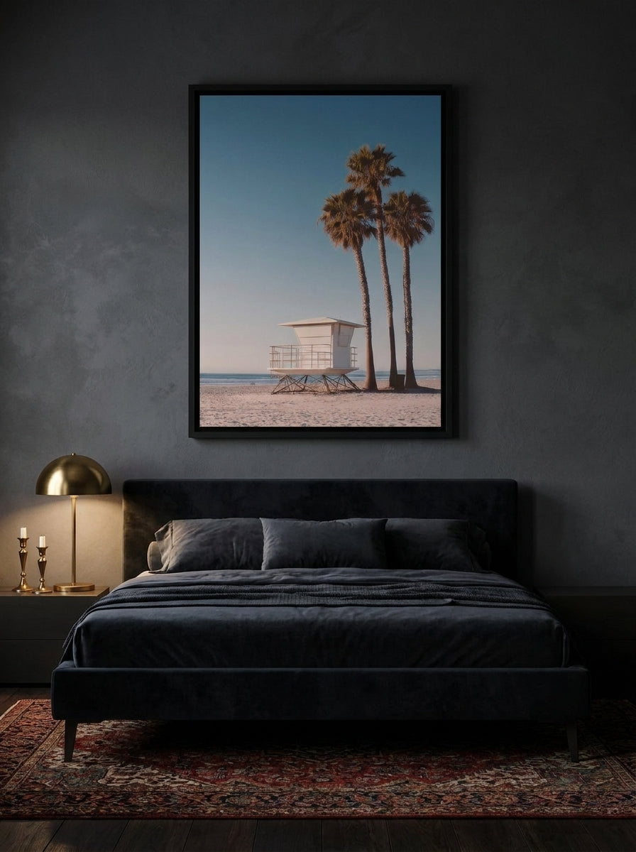 Canvas wall art with a black surround styled on the wall in a moody bedroom