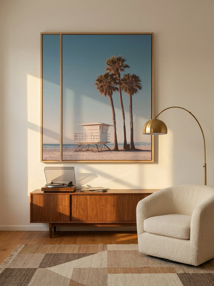 Oversized statement canvas wall art with a natural timber surround styled on the wall in a mid-century living room