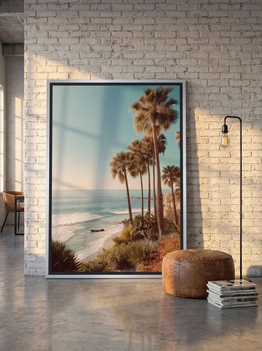 Oversized statement canvas wall art with a silver leaf surround leaning against the wall in an industrial loft dining room