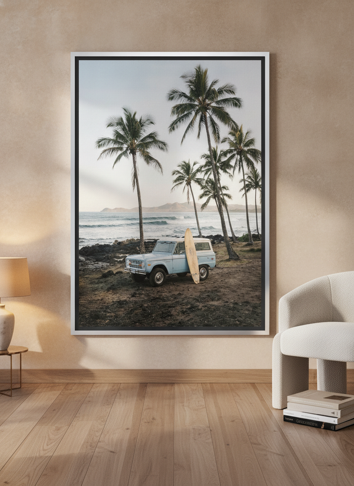 Canvas wall art with a silver leaf surround leaning against the wall in a luxe dining room