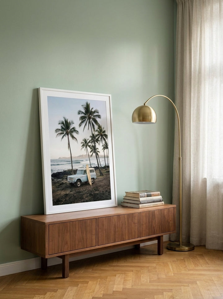 Modern wall art print standing on a sideboard in a mid-century dining room