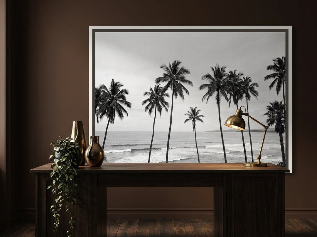 Canvas wall art with a white surround styled on the wall in a moody home office