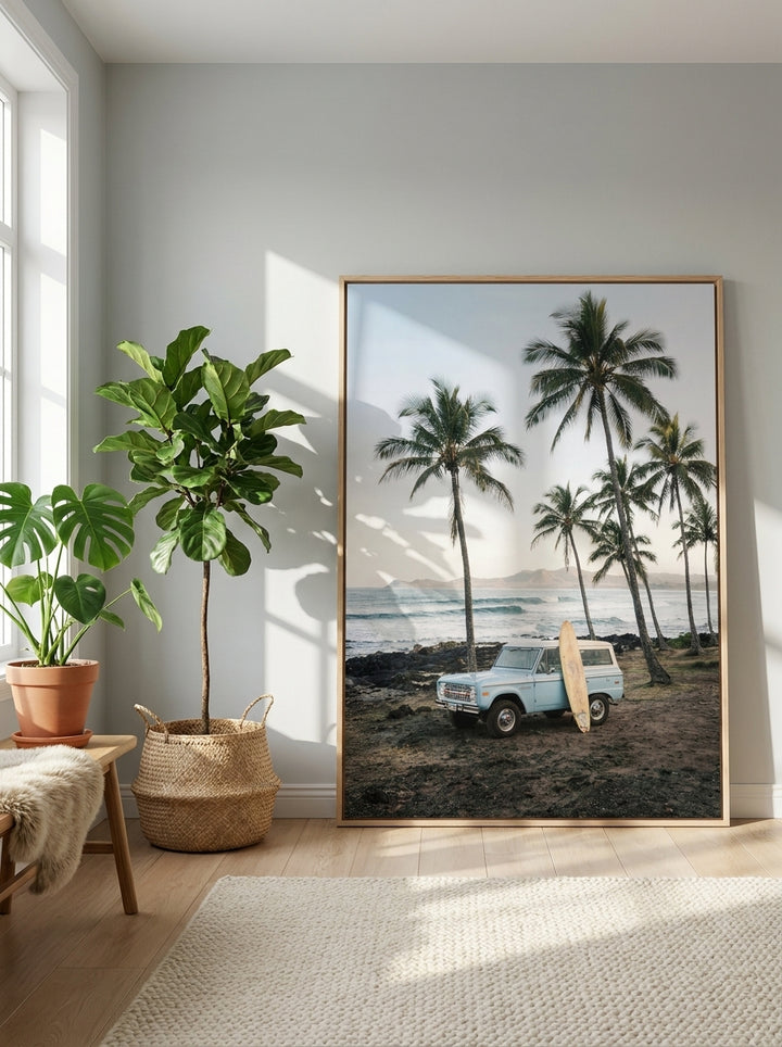 Oversized statement canvas wall art with a natural timber surround leaning against the wall in a bright Scandinavian living room