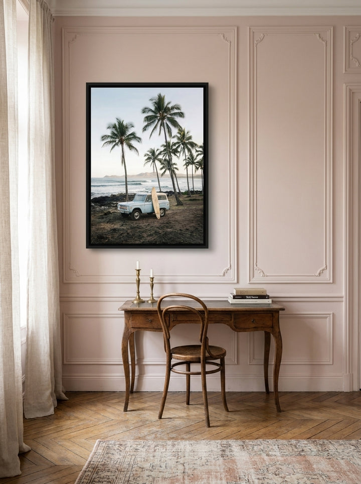 Canvas wall art with a black surround styled on the wall in a Parisian home office