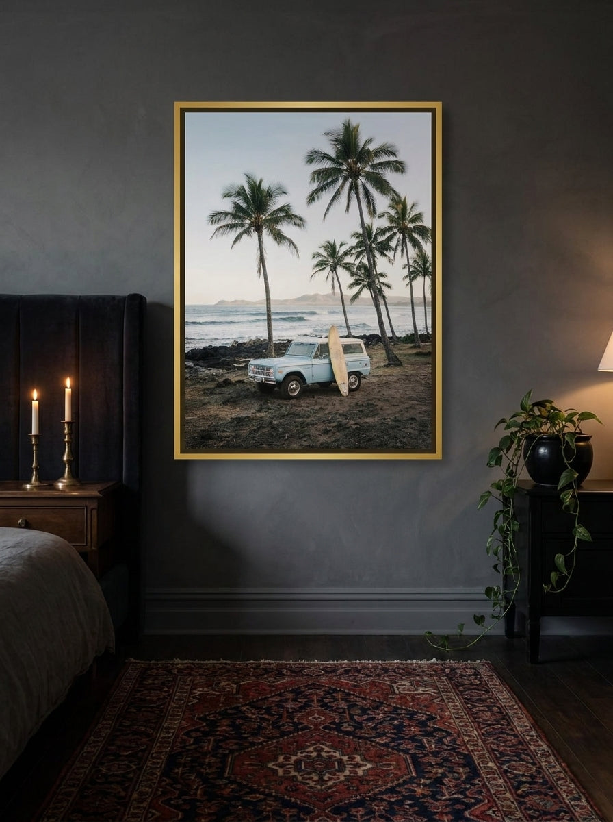 Canvas wall art with a gold leaf surround styled on the wall in a moody bedroom