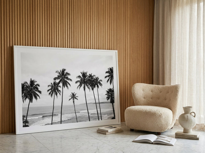 Oversized statement modern wall art print leaning against the wall in a luxe dining room