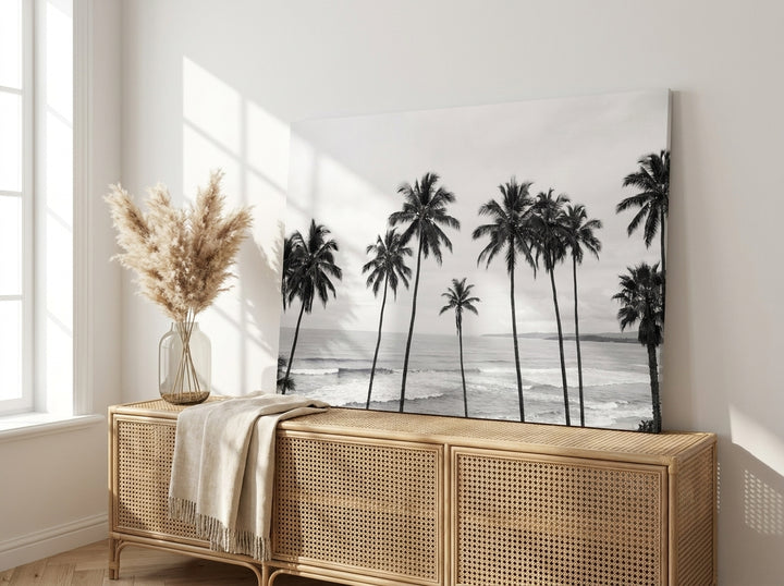 Stretched canvas wall art standing on a sideboard in a coastal bedroom