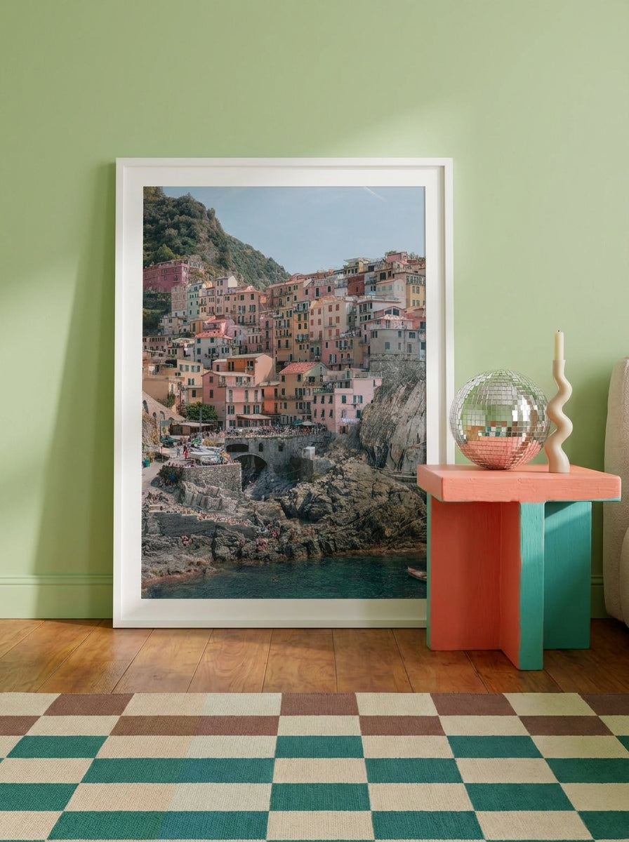 Modern wall art print standing on a side table in a colourful eclectic bedroom