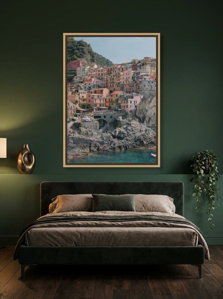 Canvas wall art with a natural timber surround styled on the wall in a moody bedroom