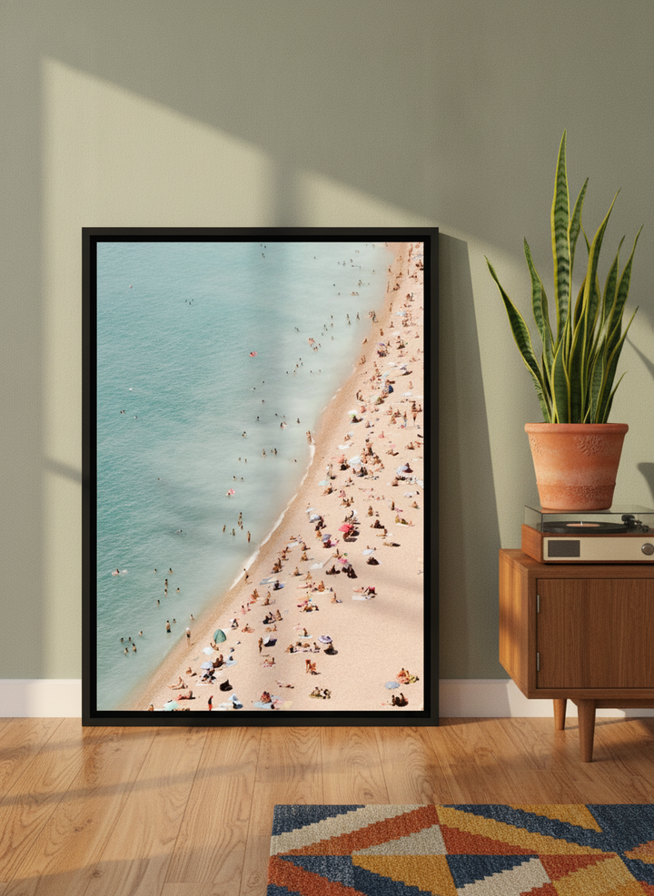 Canvas wall art with a black surround leaning against the wall in a mid-century home office