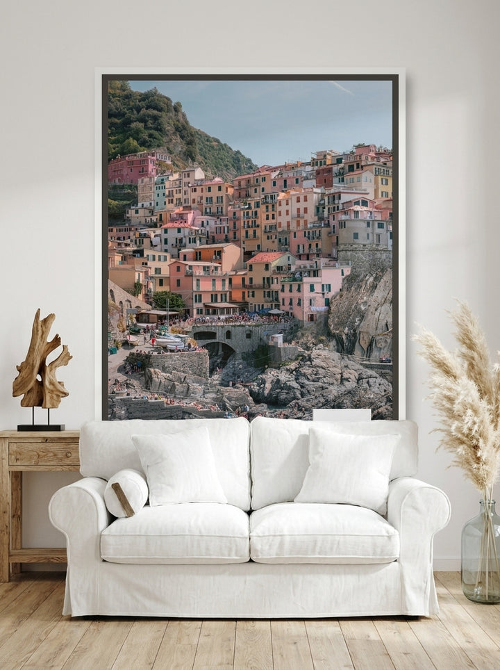 Canvas wall art with a white surround styled on the wall in a coastal living room