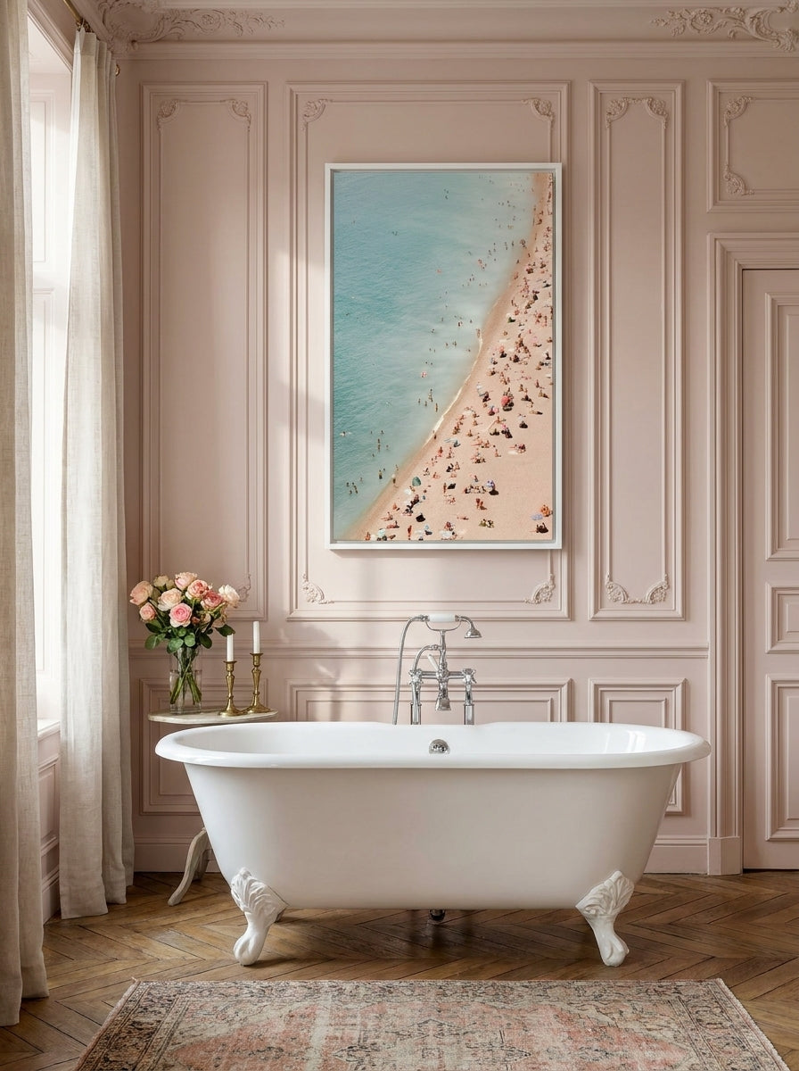 Canvas wall art with a white surround styled on the wall in a Parisian bathroom