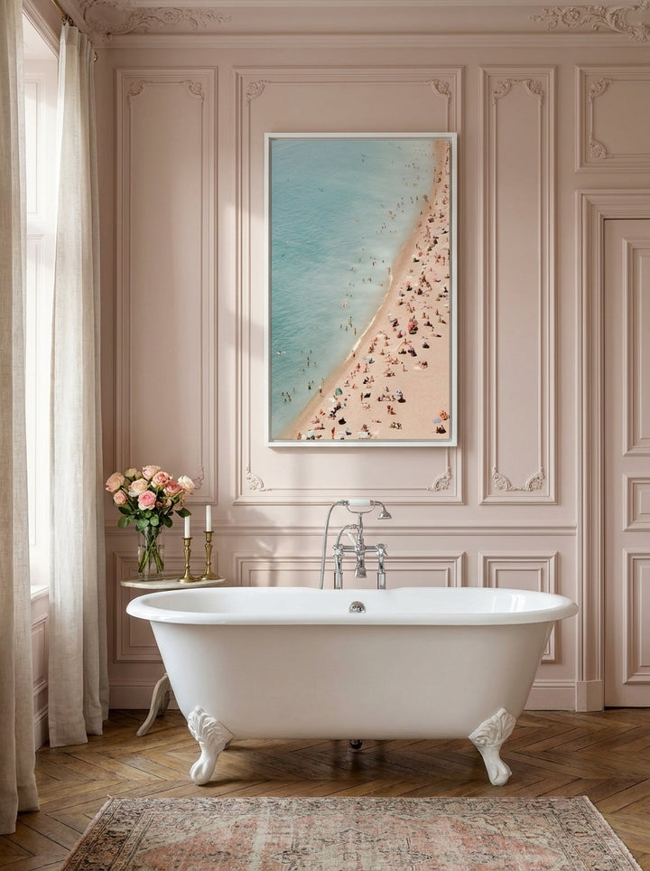 Canvas wall art with a white surround styled on the wall in a Parisian bathroom
