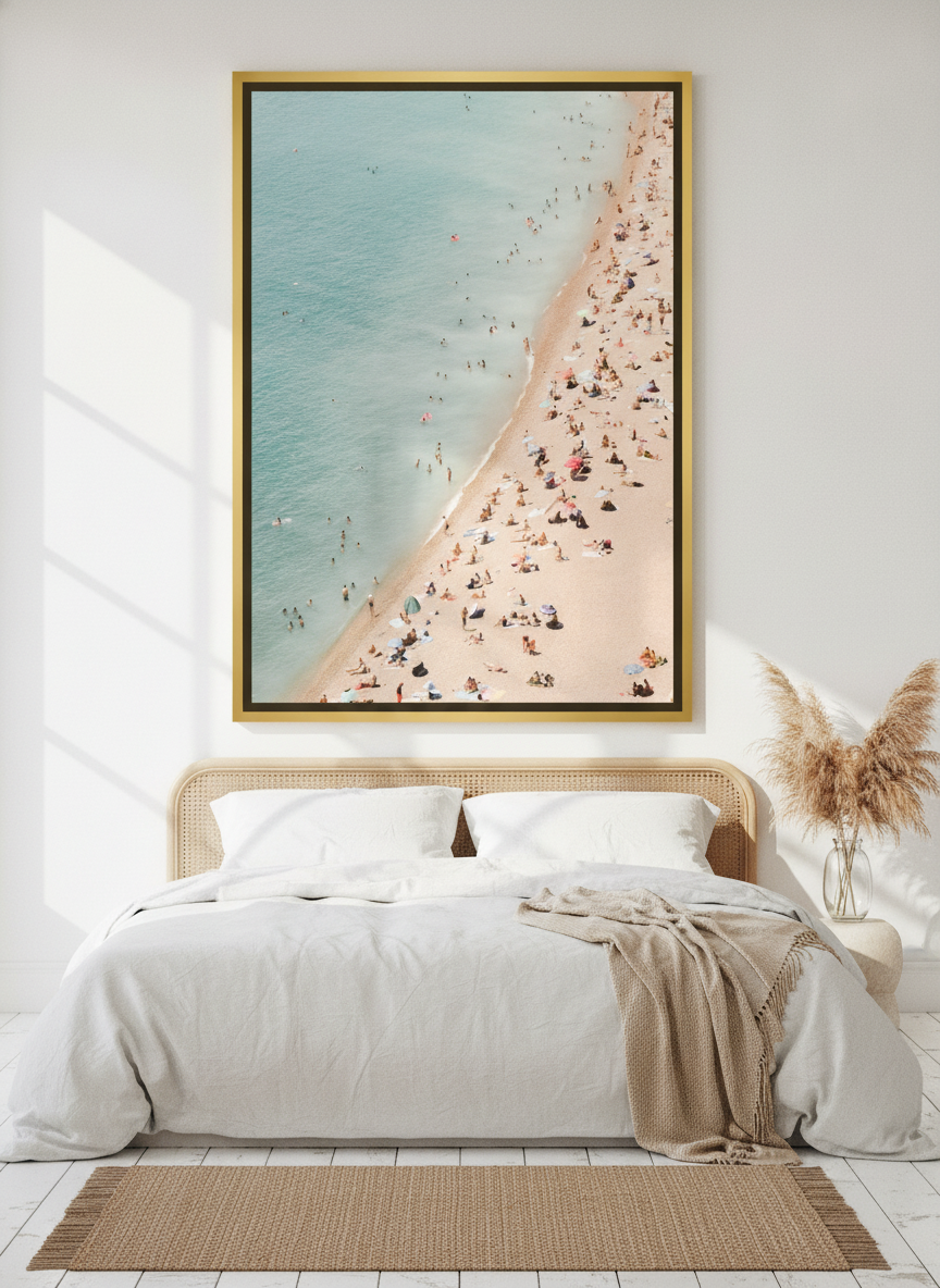 Oversized statement canvas wall art with a gold leaf surround styled on the wall in a coastal bedroom