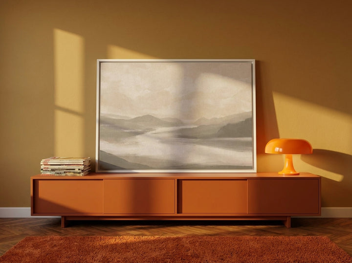 Canvas wall art with a white surround standing on a sideboard in a retro 70s bedroom