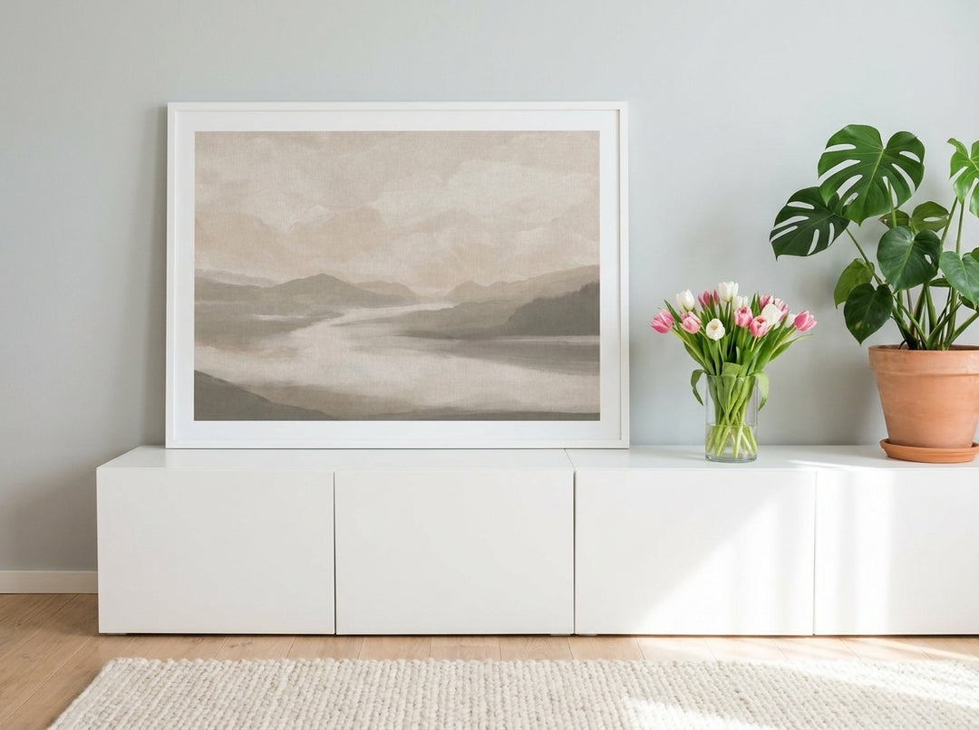Modern wall art print standing on a sideboard in a bright Scandinavian home office