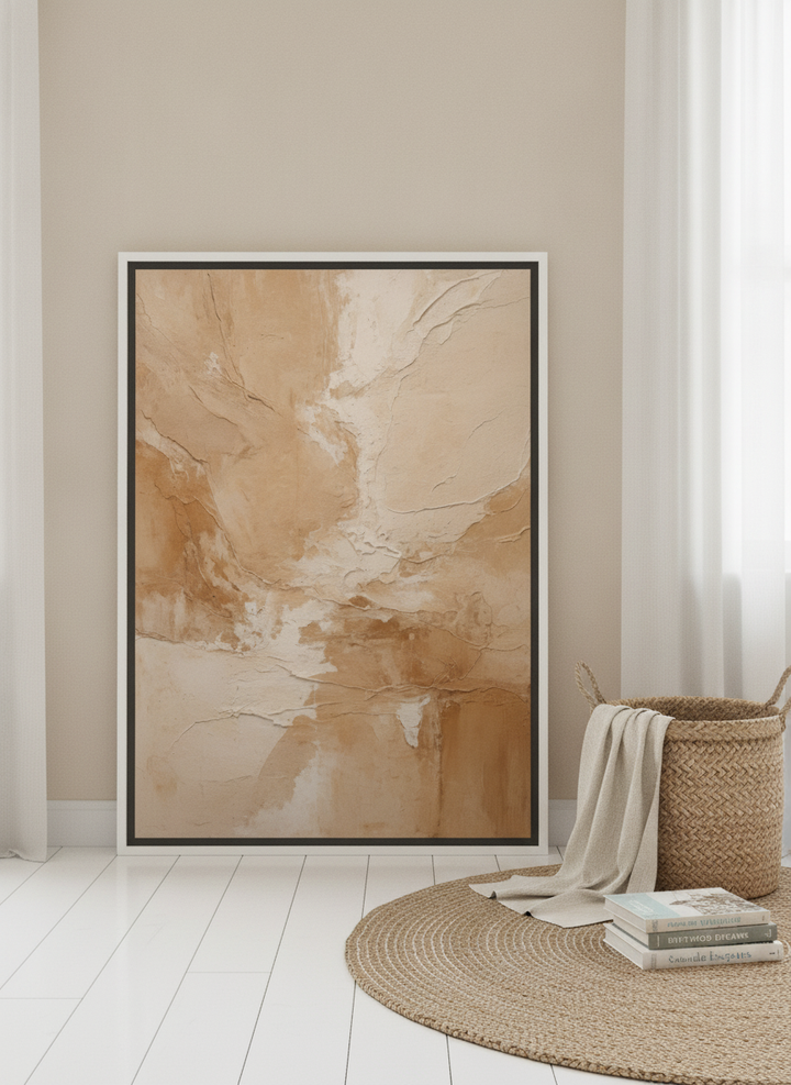 Canvas wall art with a white surround leaning against the wall in a coastal bedroom