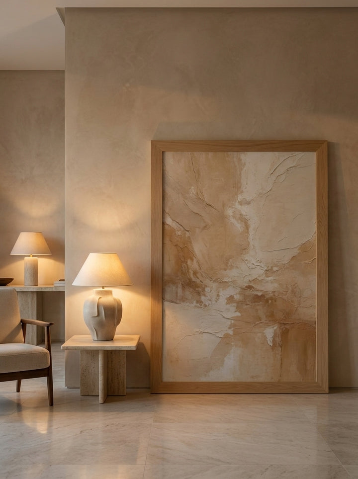 Oversized statement modern wall art print leaning against the wall in a luxe living room