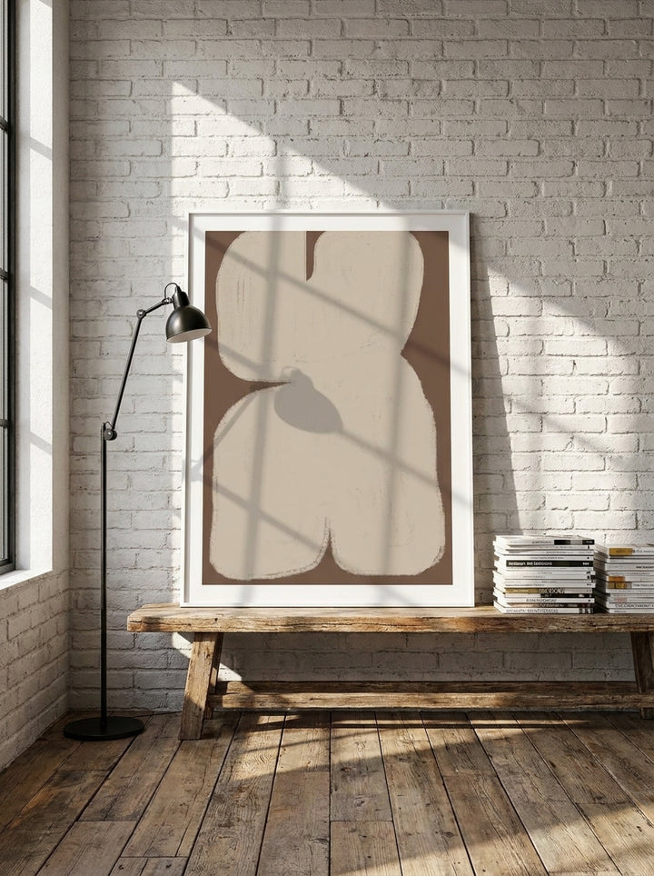 Modern wall art print standing on a bench in an industrial loft home office