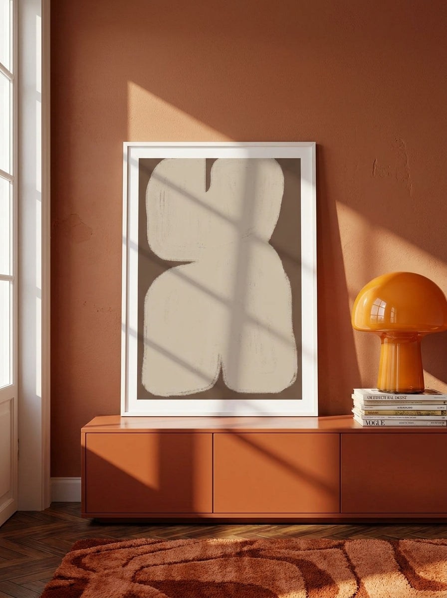 Modern wall art print standing on a sideboard in a retro 70s bedroom