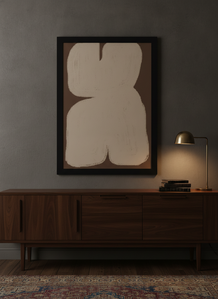 Modern wall art print styled on the wall in a moody living room