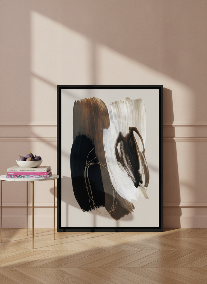 Canvas wall art with a black surround leaning against the wall in a Parisian living room