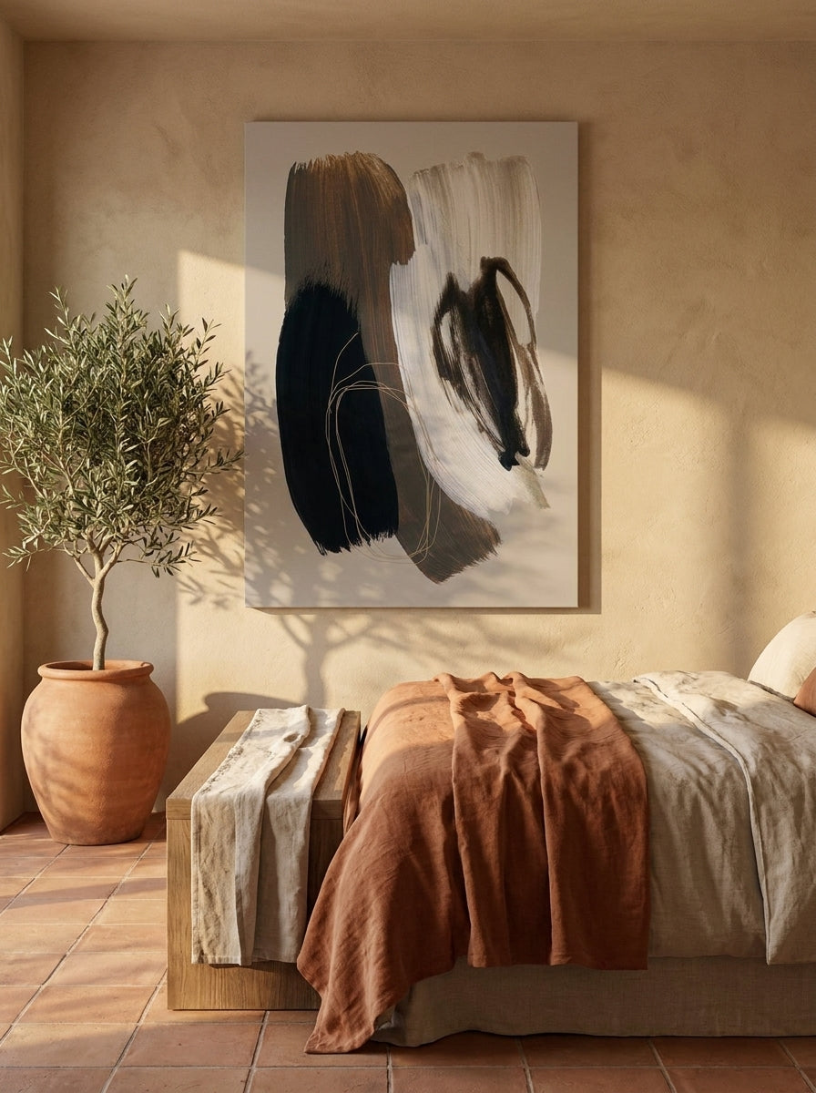 Stretched canvas wall art styled on the wall in a Mediterranean bedroom