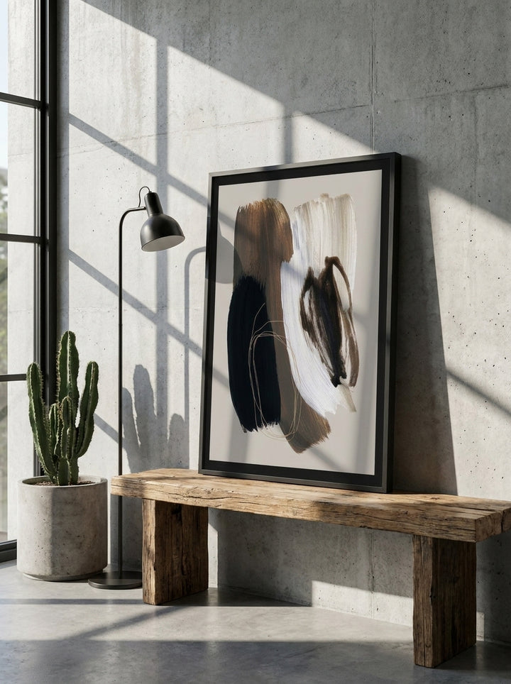 Modern wall art print standing on a bench in an industrial loft living room