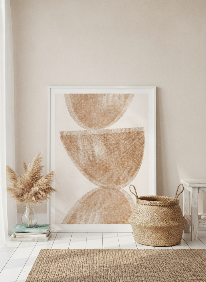 Modern wall art print leaning against the wall in a coastal bedroom