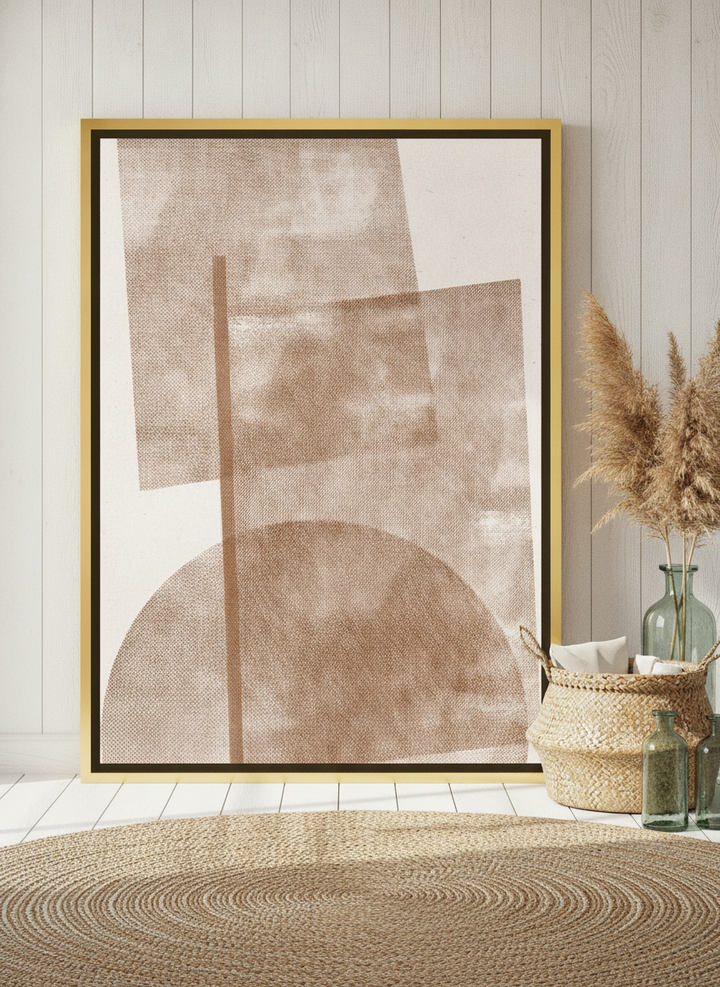 Canvas wall art with a gold leaf surround leaning against the wall in a coastal bedroom