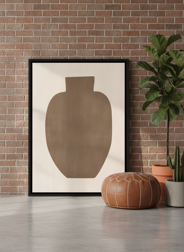 Canvas wall art with a black surround leaning against the wall in an industrial loft living room