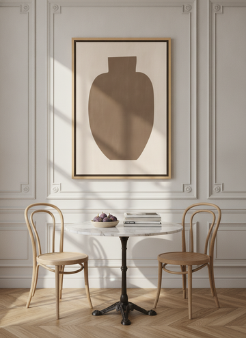 Oversized statement canvas wall art with a natural timber surround styled on the wall in a Parisian dining room