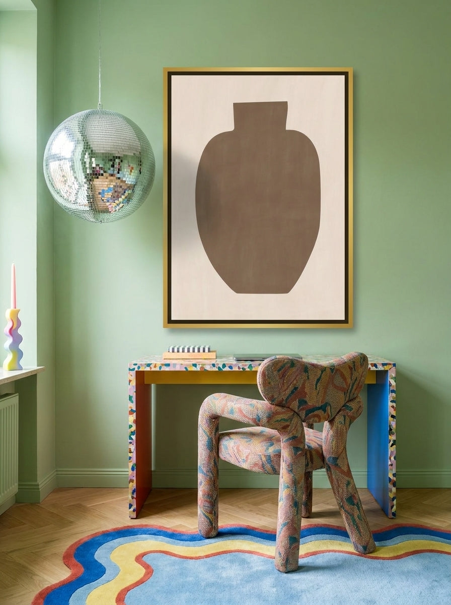 Canvas wall art with a gold leaf surround styled on the wall in a colourful eclectic home office