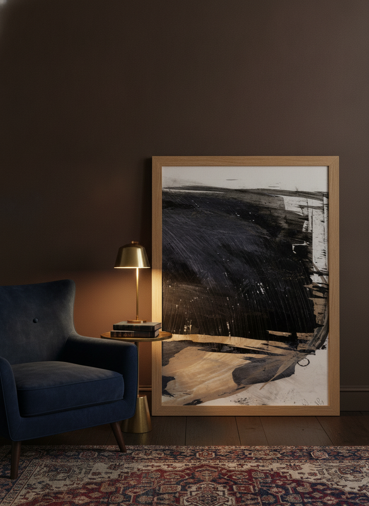 Modern wall art print leaning against the wall in a moody bedroom