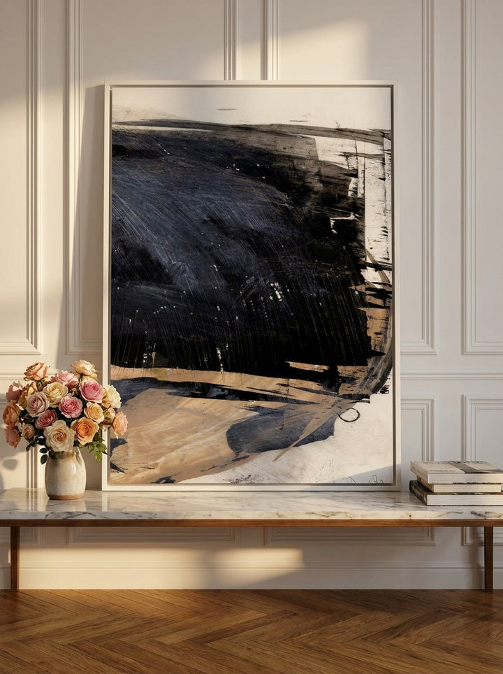 Canvas wall art with a white surround standing on a console in a Parisian home office