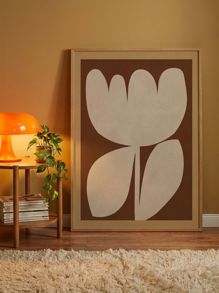 Oversized statement modern wall art print leaning against the wall in a retro 70s dining room